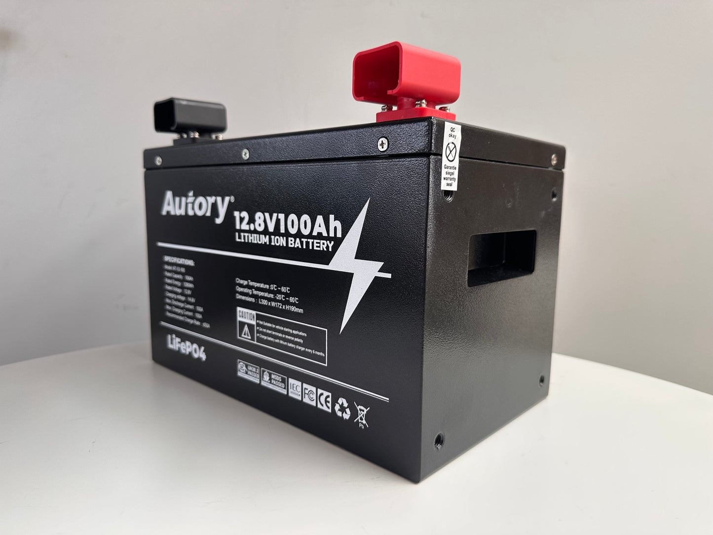 12.8V 100Ah Lithium Ion battery with metal casing, designed for high performance and durability in off-grid applications.